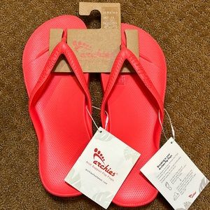 Red Archie’s flip flops